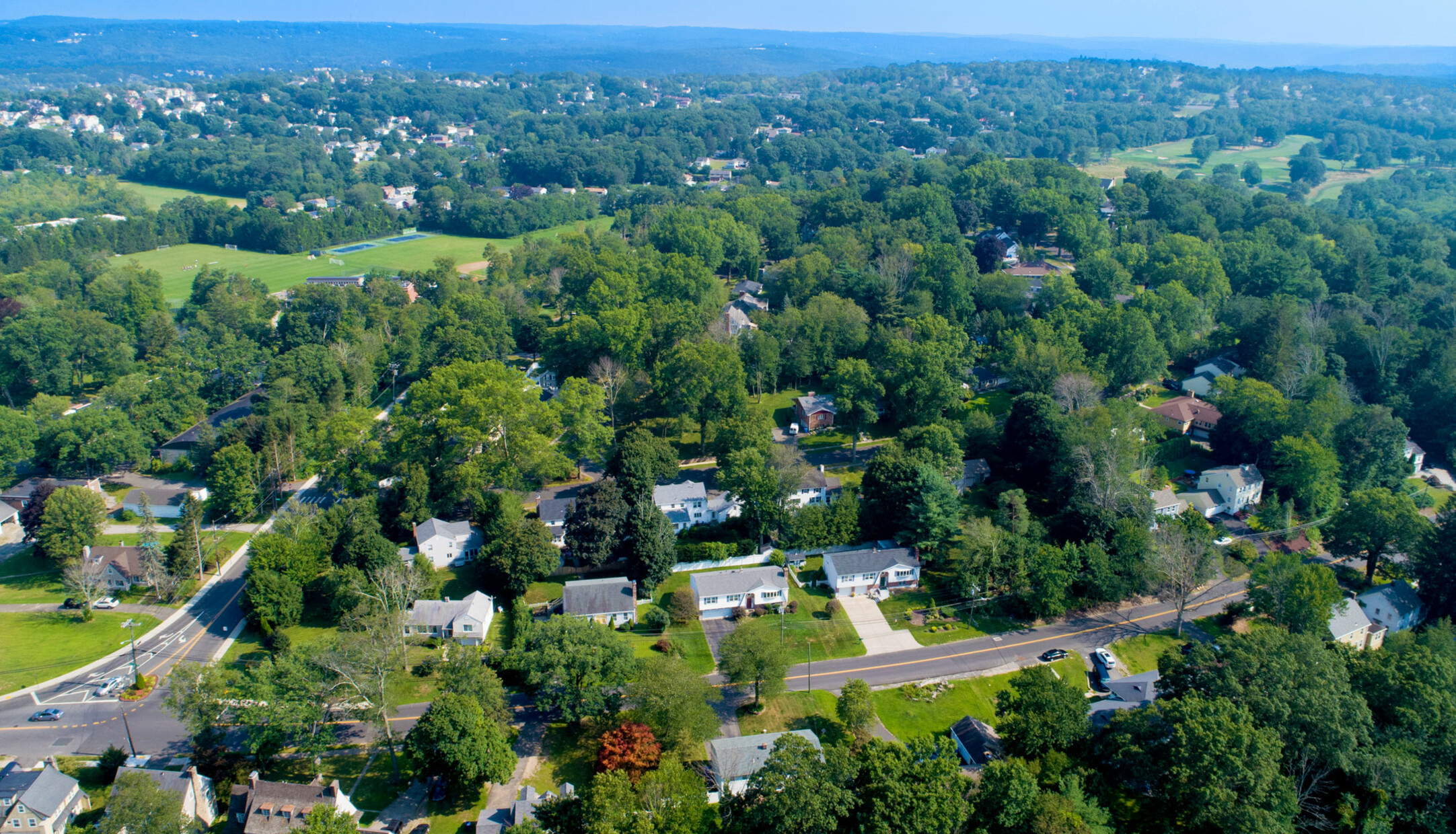 An aerial view of houses and streets in the Country Club neighborhood of Waterbury