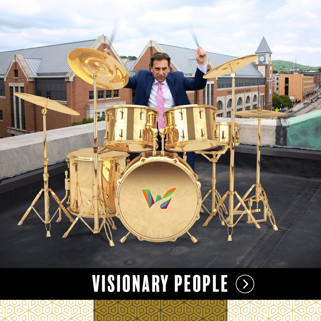 Joe Gramando of Waterbury CT playing drums on a rooftop, representing Visionary People