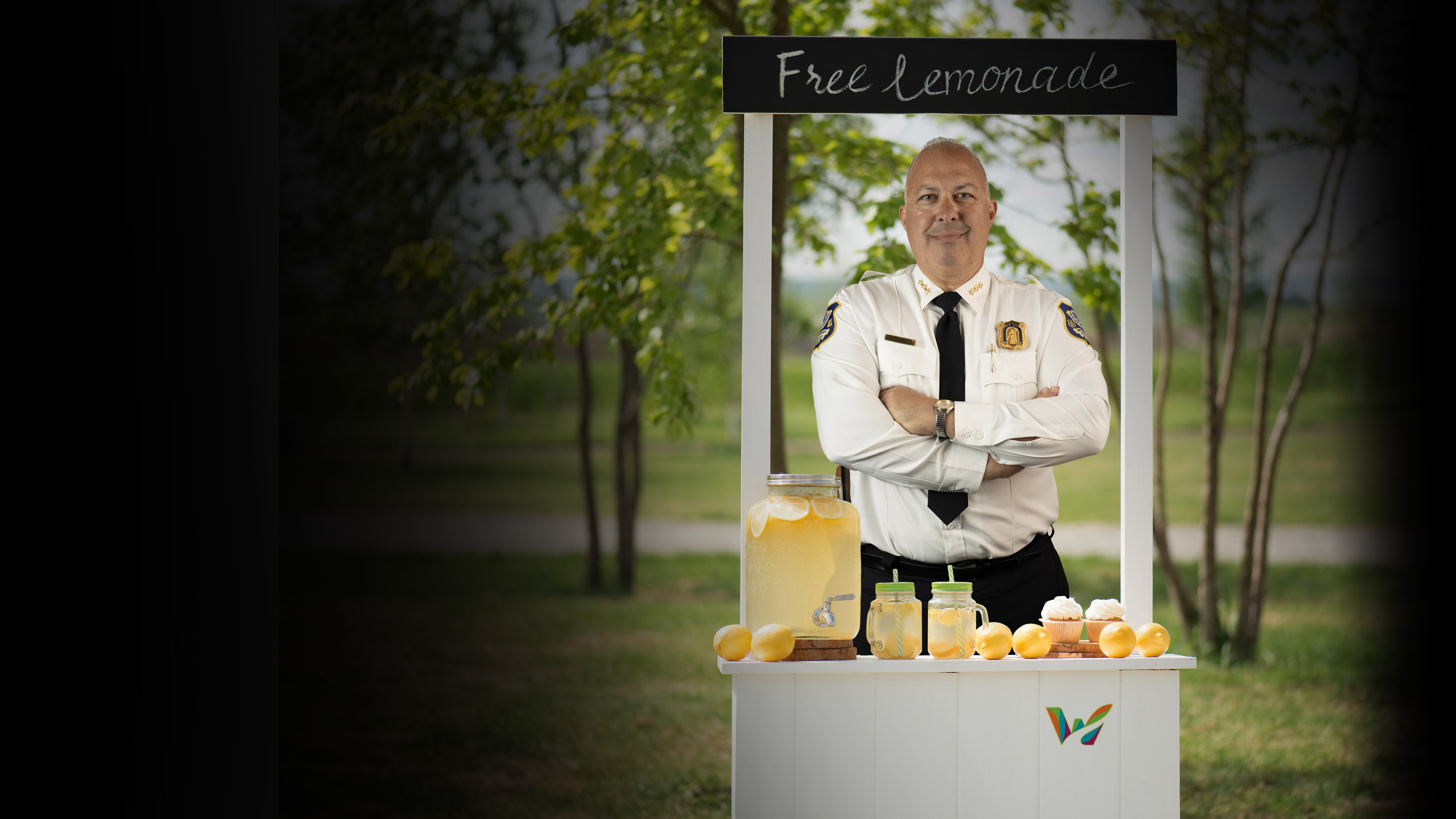 Waterbury, CT Chief of Police Fred Spagnolo standing in a community lemonade stand